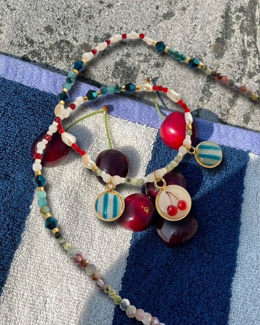Collier Cherries on the beach